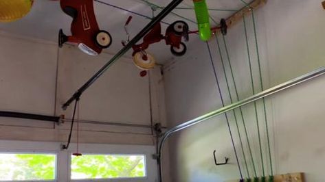 Check Out This Crazy DIY Contraption That Instantly Clears & Stores… Christmas Gifts Bags, Pulley Storage, Ideas With Fabric, Diy Overhead Garage Storage, Fabric Scrap Crafts, Garage Floors Diy, Ceiling Storage Rack, Scrap Crafts, Garage Ceiling Storage