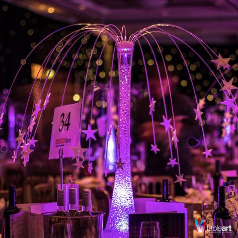 Under a canopy of Stars, guests will feel transported as they look up to the night sky. The Star Fountain table centre adds an ethereal beauty to any event. Under The Stars Quinceanera Theme, Starry Night Prom, Night To Shine, Glow Table, Sweet 16 Centerpieces, Star Centerpieces, Galaxy Wedding, Lily Vases, Dmx Lighting