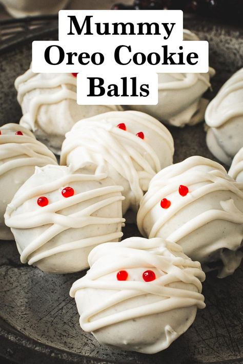 Irresistible and rich, these spooktacular Mummy Oreo Cookie Balls are a wickedly good Halloween treat and are easy to make. Coated in vanilla almond bark and filled with cream cheese and crushed Oreos they're perfect for a party, especially a Halloween charcuterie board. Oreo Mummy Cookies, Black Widow Cocktail, Black Widow Halloween, Halloween Dinner Party Food, Halloween Recipes For Kids, Egg Breakfast Casserole, Halloween Dessert Recipes, Halloween Charcuterie Board, Oreo Cookie Balls