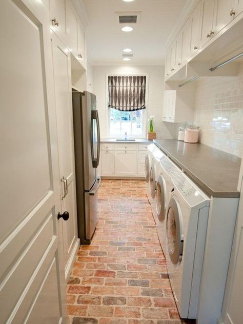 From homedit Exposed brick is also a great option for floors! These floors pop when paired with white cabinets in this gorgeous laundry room. Traditional Laundry Room, Brick Floors, Mudroom Storage, Chicago Brick, Laundry Room/mud Room, Stylish Laundry Room, Pantry Laundry, Dream Laundry Room, Mud Rooms