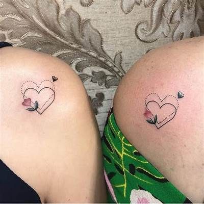 Cherish the Bond: 24 Unique Small Mother Daughter Tattoo Designs - Symbolize Your Unbreakable Connection Mother Daughter Tattoos Shoulder, Tattoos Ideas For Daughter, Mother Daughter Shoulder Tattoos, Mum And 2 Daughters Tattoo, Like Mother Like Daughter Tattoo, Mum Daughter Tattoo, Matching Mother Daughter Tattoos Meaningful, Butterfly Tattoos With Flowers, Small Matching Tattoos Mom And Daughter