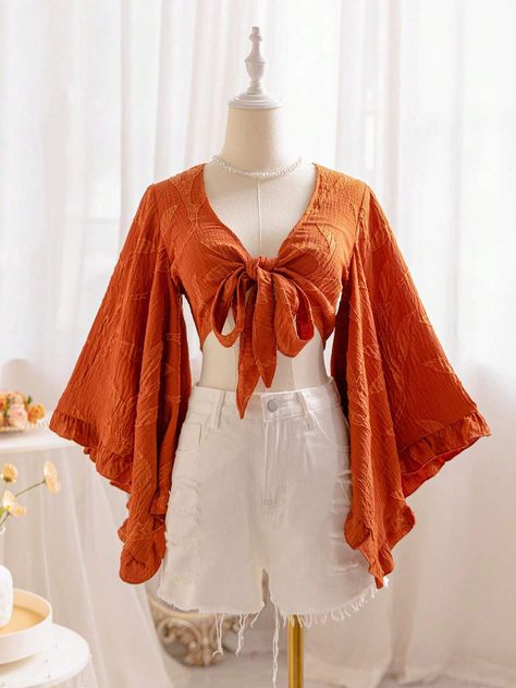 SHEIN WYWH Women's Brown Willow Texture V-Neck Tie-Front Blouse With Flared Sleeves And Ruffled Cuffs, Suitable For Vacation And Music FestivalsI discovered amazing products on SHEIN.com, come check them out! Bell Sleeve Top Outfit 70s, Feminine Long Sleeve Tops, Pirate Shirts For Women, Orange Bell Sleeve Top, 70s Wrap Top, Boho Styles For Women, Sunset Aesthetic Outfits, Sewing Clothes Women Tops, Greek Fashion Modern Casual