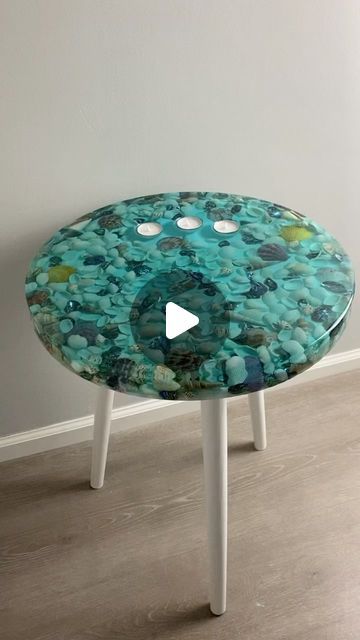 Jennifer Chapman on Instagram: "You’ve seen my shell tables before but this one as some extra sparkle. My lovely customer asked if I could add some abalone shell pieces into it too. I love when you walk past the table and the abalone shimmer.   @totalboat fathom resin and tabletop resin  @craftedelementsco silicone mold  #inart #ocean #oceanart #turquoise #shells #stones #waves #beach #calm #vacation #resin #resinart #epoxy #epoxyresin #coastline #tropical #stonesbeach #tranqui #coastalart #oceanside #beachday #lakes #beachvibes #paradise #candles #candleholder #tealights #summervibes #tranquility #sidetable" Resin Table Top, Waves Beach, Resin Table, Coastal Art, Ocean Art, Beach Scenes, Abalone Shell, Table Tops, Silicone Mold