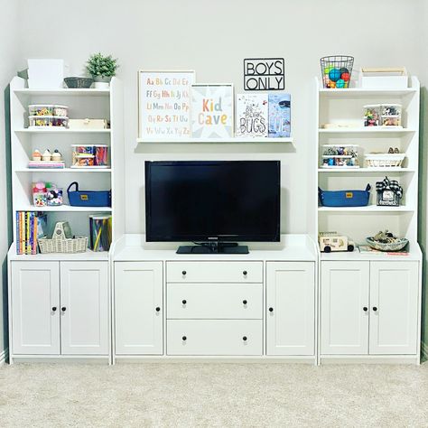 Follow Me On Instagram @alifemoreorganized - https://www.instagram.com/alifemoreorganized/ #playroom #playroomorganization #organizedplayroom #ikea #ikeaplayroom #ikeafurniture #ikeahauga #hauga #ikeabookshelf #bookshelf #bookshelves #whitebookshelf #wallshelf #wallshelves #shelfie #tvstand #toyorganization #organizedtoys #playroomdecor #playroominspo #playroomideas #playroomdesign #playroomgoals #playroomstorage #toystorage #craftsupplies #craftsupply #safariltd #lazysusan #organization Ikea Playroom With Tv, Playroom With Black Furniture, Ikea Hauga Storage Playroom, Ikea Hauga Playroom, Playroom Organization With Tv, Ikea Bookshelf Playroom, Playroom Storage Ideas Ikea, Hauga Ikea Living Room, Ikea Hauga Office