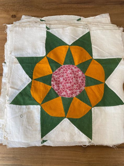 Set of 19 vintage quilt blocks in green and mustard yellow solid fabrics with a pinkish red calico center circle.  The blocks are not an exact match to the Ezekial's Wheel block pattern however that seems to be the pattern they most closely align to.   White fabric has aged to more of an antique white color and there are blocks that have stains.  Seams are intact and there are no rips or holes.   Blocks measure 13 x 13. From an estate sale held in Colubia IL. Please note these vintage quilts blocks have been well loved and vintage textiles always have wear and tear consistent with their age.  I have made every effort to provide an accurate, complete description.  Make sure you closely review the photos and if you have questions, message me. Color Wheel Quilt, Quilt Pattern Simple, Vintage Textiles Patterns, Vintage Quilt Blocks, Quirky Quilts, Quilt Board, Amish Quilt, Quilts Blocks, Quilts Modern