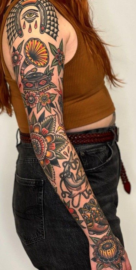 American Style Sleeve Tattoo, Black White And Red Tattoo Sleeve, American Traditional Tattoos Arm Sleeve, Neotraditional Patchwork Tattoo, 444 Traditional Tattoo, American Traditional Lilly Tattoo, Traditional Style Filler Tattoo, Old School Sleeve Women, Women Chest Tattoo Traditional