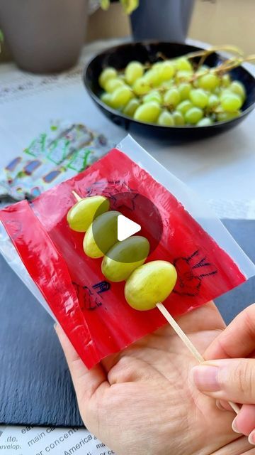 Tinka on Instagram: "Frozen Fruit Roll-Up Skewer Grapes 🍡🍇 Looking for a fun new way to enjoy frozen grapes? Try this creative twist with Fruit Roll-Ups! Drizzle with fresh lime juice for an extra zesty kick 🍋

Ingredients:
- Green grapes
- Fruit Roll-Ups
- Lime juice

Thread the grapes onto skewers and wrap them with Fruit Roll-Ups. Freeze until solid. Life hack: Use the plastic wrapper to easily wrap the grapes without them sticking 😌

Save this recipe for a new way of eating Fruit Roll-Up Grapes and follow for more snack ideas! 😍

#fruitrollups #fruitrollup #grapes #candygrapes #frozengrapes #frozen #sweetsour #sweetandsour #snack #snackidea #fruits #fruitlover #fruitasmr #summersnacks #asmr #asmrvideo #asmrsound #asmrcommunity #healthysnacks #healthyrecipes #easysnack #quicksnack" Fruit Roll Up Grapes, Green Snacks For Color Party, Jolly Rancher Grapes, Grapes Fruit, Fruits Snacks, Eating Fruit, Frozen Grapes, Yummy Deserts, Fruit Roll