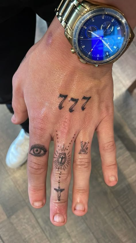 Hand tattoo for men, angel numbers, eye, cross, religious, love, LV Men Angel Number Tattoo, Guys With Hand Tattoos, Hand Tattoos Man, Religious Hand Tattoo, Small Hand Tattoos For Guys Ideas, Angel Number Tattoo Men, Cross Hand Tattoo Men, Hand Tattoo Men Ideas, Number Tattoo Men