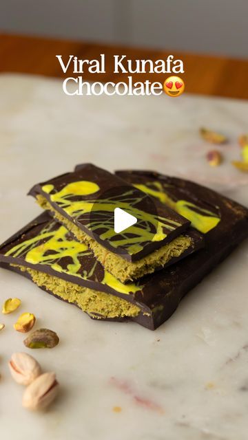 Saloni Kukreja🌷 on Instagram: "Viral Kunafa Pistachio Chocolate Bar 😍😍 The easiest way to make this recipe at home without a mold! The pistachio filling uses simple, readily available ingredients. This doesn’t disappoint, I recommend it 10/10!!   Ingredients:   •1/3rd cup roasted pistachios - ground up   •1/2 cup white chocolate   •1 teaspoon Tahini  •Green food colour (optional) • 1-2 Tbsps Pistachio butter(optional)   Chocolate:    •1/3rd cup dark compound or dark chocolate   •1/3rd cup milk compound or milk chocolate    • 3 Tbsps Ghee   •1/2 cup Kunafa - chopped   •2 tbsps white chocolate + Yellow colour or turmeric powder   Process:  - Start by melting the white chocolate and add turmeric powder for the colour  - Line your tin with parchment paper - you could also use a silicone mou Pistachio Kunafa Chocolate Bar, Kanafeh Chocolate Bar, Kunafa Chocolate Recipe, Kunafa Chocolate Bar, Chocolate Kunafa Recipe, Saloni Kukreja, Kunafa Chocolate, Pistachio Filling, Kunafa Recipe