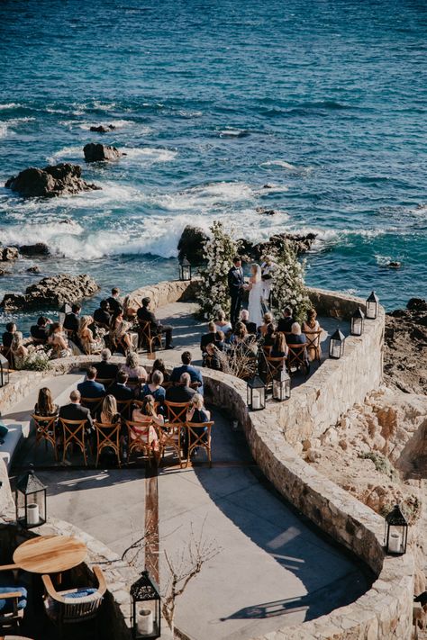 A beautiful beachside wedding set-up at the Esperanza resort in Cabo San Lucas, with blue ocean waves and palm trees in the background. The decor features colorful floral arrangements, elegant table settings, and romantic string lights creating a magical ambiance. #love #wedding #weddingplanner #weddingplanning #destinationwedding #mexico #loscabos #luxury #luxurywedding Esperanza Auberge Resort Wedding, Beach Wedding Europe, Beach Castle Wedding, Esperanza Wedding Cabo, Esperanza Cabo Wedding, Wedding By The Ocean, Greece Beach Wedding, Cabo San Lucas Wedding Venues, Cozumel Wedding