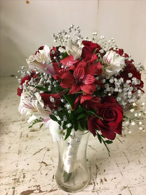 One of our custom bouquets from a wedding. Baby’s breath tinited sliver, a few red roses and white and red alstroemeria with a white wrap around the stems White Bouquet Red Accents, Baby Rose Bouquet, Simple Red Bouquet, Red And White Wedding Aesthetic, White And Red Wedding Flowers, Prom Bouquet Red Dress, Small Red Bouquet, Red Prom Bouquet Ideas, Red And White Flower Bouquets