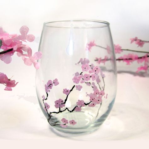 How to hand paint glass with flowers such as these lovely spring cherry blossoms using Martha Stewart Crafts glass paint and simple wine glasses from a dollar store. DIY, handmade, Martha Stewart Crafts, Glass Paint, Cherry Blossom, how-to, Pink flowers, Cherry Tree, make your own, homemade Camping Wine Glasses, Glasses Painting, Goodbye Winter, Diy Wedding Video, Glass Painting Designs, Amazing Finds, Martha Stewart Crafts, Cherry Blossom Branch, Wine Glass Crafts