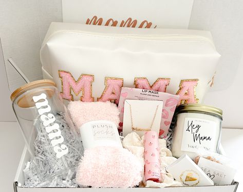 Are you looking for the perfect gift basket for that special woman in your life? Look no further our MAMA deluxe gift box.  This perfectly curated multi-purpose bag is the ideal gift for all the moms out there!  All our boxes are hand packed with the highest quality of comfort items and made specially for you. Want to change out items or make substitutions?  Let us know and we can make you a custom box.  GIFT BOX INCLUDES: ♥ 8oz "Hey Mama You Git This" jar candle with bamboo lid ♥ mini matchbox with gold heart detail ♥ moisturizing lip balm ♥ delicious sea salt caramels ♥ adorable elastic beaded bracelets with a gold heart charm. (4) ♥ MAMA multi-purpose toiletries/ makeup bag  ♥ MAMA gold tone necklace ♥ light weight solid scrunchie hair tie ♥ plush solid socks perfect for year round ♥  M New Mommy Care Package, Gifts For A New Mom Care Packages, Soon To Be Mom Gift Basket, Mama To Be Gift Basket, Gift Baskets For New Moms, Pregnancy Basket Care Packages, Mom To Be Basket, Christmas Basket For Mom, Post Partum Gifts Basket New Moms