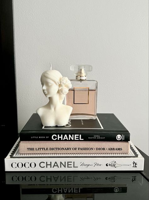 CHANEL Perfume, Homemade Candle, and a Stack of Fashion Books Designer Book Aesthetic, Dior Book Decor, Little Book Of Chanel, Fashion Themed Room, Chanel Aesthetic Bedroom, Designer Books Aesthetic, Chanel Book Aesthetic, Coco Chanel Room, Fashion Books Decor