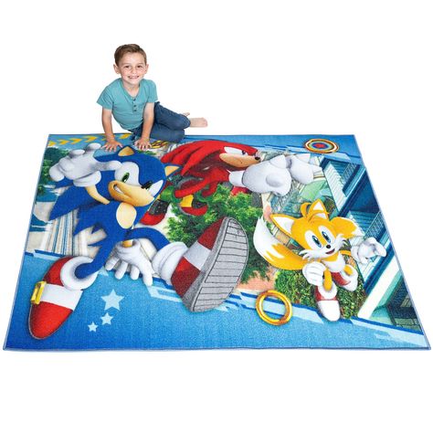 PRICES MAY VARY. 100% Nylon SONIC THE HEDGEHOG DESIGN: Surprise young gamers with the high-speed style of this Sonic area rug. Iconic SEGA videogame characters Sonic, Knuckles and Tails race into action in the "Fastest Friends" pattern against a colorful background. Sonic the Hedgehog fans are sure to enjoy the bold, animated look of this soft and stylish rug. VERSATILE USE: With a fun design, both kids and parents will love this soft and stylish rug is a versatile addition at home to a nursery, Sonic The Hedgehog Anime, Sonic Knuckles And Tails, Knuckles And Tails, Videogame Characters, Sonic Knuckles, Hedgehog Design, Kids Room Furniture, Floor Safe, Video Game Rooms