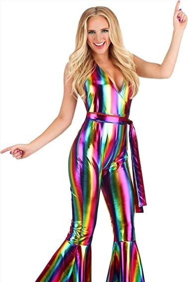 Get ready to boogie the night away in this rainbow rave outfit for women. This jumpsuit features a mock-wrap bodice that has halter ties made of the same fabric. The pants portion has a concealed back zipper to help get the jumpsuit on and off. The pant legs flare widely below the knees for that classic 70s look. Elton John Costume Women, 70s Theme Party Outfit For Women, Disco Party Clothes, 70s Costume Ideas, Disco Theme Party Outfit, Disco Costume For Women, Disco Party Costume, 70s Disco Outfit, Pride Dress