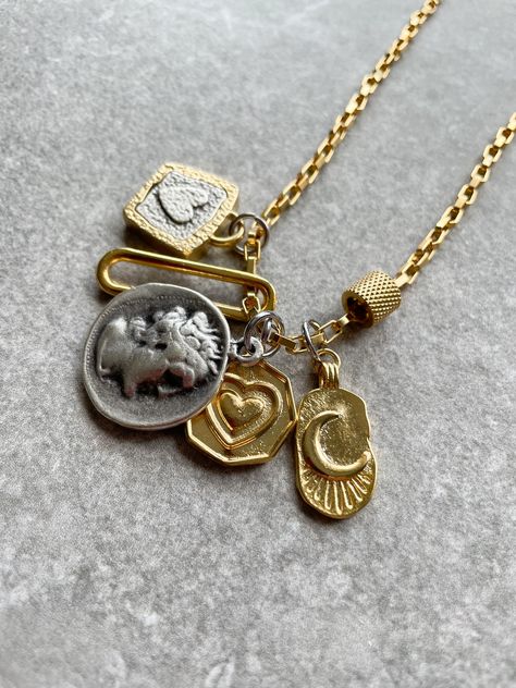 Handcrafted  by IJ Design Boutique 🤍🌟 High quality , unique and modern necklace with heart charms, Greek coin pendant mixed metal trendy necklace. Long 18k gold plated chain. Made of: * 18k gold plated  * Stainless steel  * 18k gold plated heart charms  * 18k gold plated clasp * Anti-allergenic * Long lasting Length customised. -IJ DESIGN BOUTIQUE- From necklaces to earrings, we make jewellery using a wide range of materials. From silver and gold plated to freshwater pearls and real gemstones. Mixed Metal Charm Necklace, Mixed Metal Necklace Stack, 2024 Jewelry Trend, Greek Coin Pendant, Gold Long Chain, Mixed Metal Necklace, Metal Pendant Necklace, Ancient Greek Coin, Heart Charm Necklace