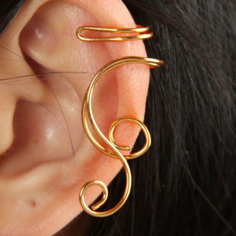 Classic Curled Ear Wrap ~ Gold Condition: 100% Brand New Type: Ear Wrap / Ear Cuff / Earring Style: Ear Wrap / Ear Cuff / Earring Design: Music Note Metal Color: Gold Size: Adjustable Os Metal: Alloy Poly Bagged: Individually Ear: Worn On The Left Or Right Piercing: Not Required Packaged: 1-Pc. Ear Wrap / Ear Cuff / Earring Gender: Unisex Catalog #: Ew-563 Ear Cuff Diy, Wire Ear Cuffs, Wire Jewelry Patterns, Ear Cuff Jewelry, Classic Music, Punk Earrings, Gold Ear Cuff, Silver Ear Cuff, Ear Cuff Earings