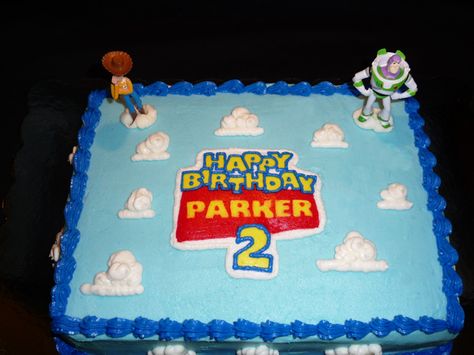 Toy Story - This is a 1/4 sheet cake for a little boy's second birthday.  I wanted to do something stacked and really cool, but this is what his mom decided on.  She provided the Woody and Buzz for the top of the cake.  I originally wanted to do some of the other characters from the movie in chocolate transfers, but I could not get it to work.  I decided to just put more clouds around the sides of the cake. Toy Story Sheet Cake, Story Sheet, Toy Story Birthday Cake, Birthday Sheet Cakes, Toy Story Theme, Toy Story Cakes, Story Birthday, Toy Story Birthday Party, Homemade Toys