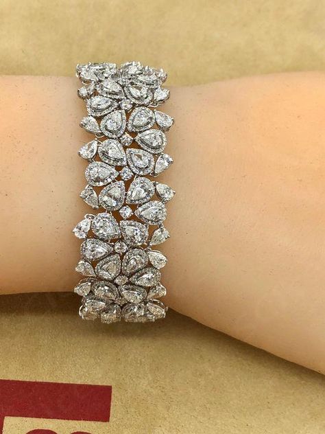 Hand made in the Emilio Atelier this bracelet is 21mm wide and 7 inches long. 265 pear shape and round diamonds totaling approx 22.20 carats of diamonds. Set in 18k white gold. Color: E-F Clarity: Vvs1-Vs2 overall Professional appraisal included  ... daha fazla Fancy Diamond Bracelet, Real Diamond Bracelet Designs, Diamond Hand Bracelet, Emilio Jewelry, Antique Amethyst Ring, Diamond Bracelet Design, Designer Diamond Jewellery, Retro Bracelet, Bridal Diamond Jewellery