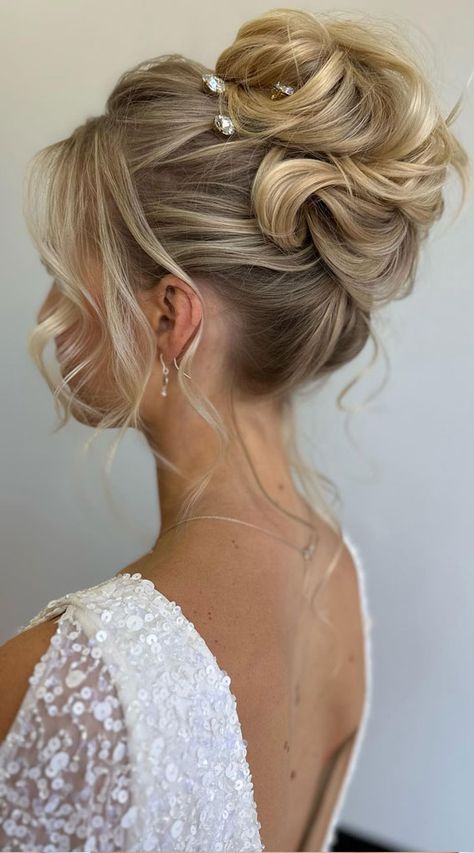 chic updo, hairstyle ideas, wedding hairstyle, wedding updo, updos, bridal hairstyle, bridal updos, messy updo, simple updo, messy upstyle, wedding hairstyle trends High Up Bridal Hair, High French Twist Updo Wedding, Bride Updos For Long Hair With Veil, Top Of Head Updo, Wedding Updos For Round Faces, Wedding French Twist Updo, Races Hairstyles Fascinator, High Wedding Updo With Veil, Volume Updo Wedding