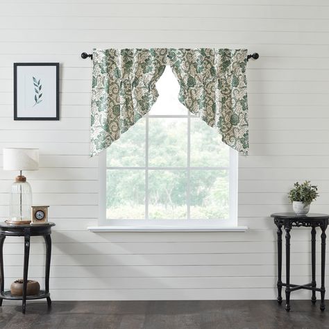 This Dorset Green Floral Prairie Swag Set of two adds a classic farmhouse touch to your decor. Shades of natural creme, dark basil, and evergreen accented along with straight edges, drawstring ties, and a sub weave technique add a cottage element to offset your decor. This 36x36x18 farmhouse swag set is perfect for protecting your cottage living space from the rays of the sun. Features Farmhouse Swag Set — Includes 2 swags (36x36x18); This farmhouse swag set makes a charming gift for any occasio Prairie Curtains, Farmhouse Swag, Swag Curtains, Kitchen Window Curtains, Vhc Brands, Floral Room, Farmhouse Curtains, Floral Swag, Rod Pocket Curtain Panels