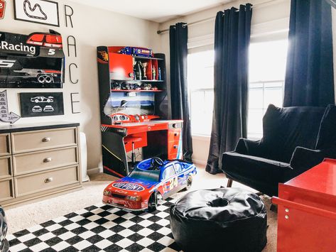 Modern Car Themed Bedroom, Nascar Bedroom Ideas, Boys Racecar Bedroom Ideas, Toddler Race Car Room, Boys Race Car Bedroom, Race Car Toddler Room, Race Car Bedroom Toddler, Nascar Room, Racing Bedroom