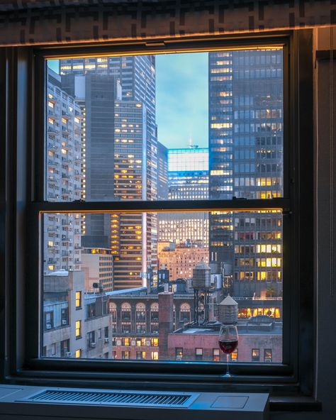 View from a Manhattan Window, City lights with a glass of wine urban vibe. New York CIty New York City Window View, City Lights From Window, City Outside Window, City From Window View, Window With City View, New York Window View Aesthetic, View From Window City, City View From Apartment, City Through Window