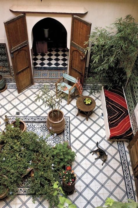 Borrowed from Moorish influences, we're loving patios with patterned tile underfoot, just like this lush Moroccan courtyard lounge area here. Moroccan Riad Courtyards, Moroccan Courtyard, Moroccan Garden, Moroccan Riad, Terraced Landscaping, Moroccan Homes, Moroccan Interiors, Patio Tiles, Patio Interior