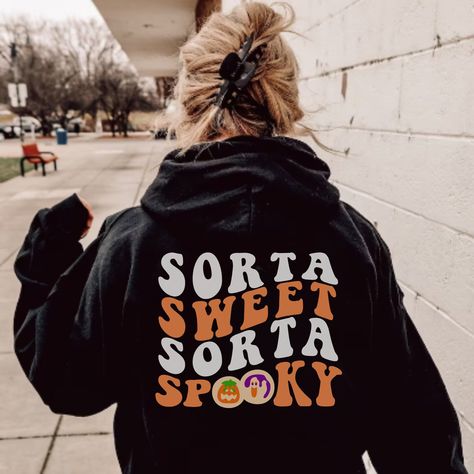 If you love Halloween & sweet treats - you NEED this printed Sorta Sweet Sorta Spooky Halloween Sugar Cookie hoodie! It features a Sorta Sweet Sorta Spooky design on the back and printed cookie pairing on the front. This is super cozy and perfect for the fall season- would also make a great gift for someone that is obsessed with all things Halloween/Fall. Note: Both front & back designs are screen printed. If you prefer embroidered instead of screen printed you can check out our embroidered list Halloween Hoodies For Women, Everything Halloween, Vsco Halloween, Cookies Hoodie, Y2k Halloween, Preppy Halloween, Halloween Hoodies, Halloween Sugar Cookies, Halloween Cookie