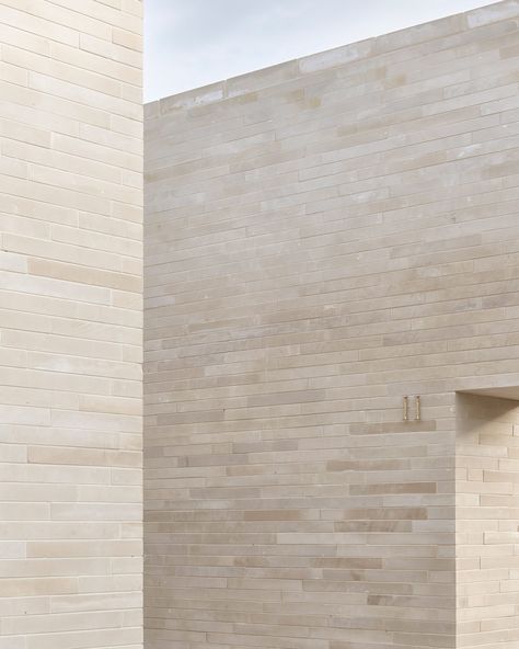 BDR Architekci clads columbarium in Poland with pale sandstone Ecumenical Chapel, Sandstone Facade, Sandstone Architecture, Sandstone Cladding, Open Air Chapel, Sandstone Texture, American Cemetery, Sandstone Wall, Intimate Space