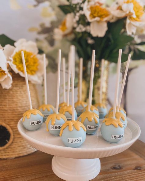 Pooh bear baby shower cake pops Winnie The Pooh Cake Pops Showers, Vintage Winnie The Pooh Cake Pops, Hundred Acre Woods Cake, Winnie The Pooh 1st Bday Party, Whinne Pooh Baby Shower Ideas, Whine Pooh Baby Shower Ideas, Winnie The Pooh Cakepops, Pooh Bear Cake Pops, Pooh Bear Baby Shower Theme