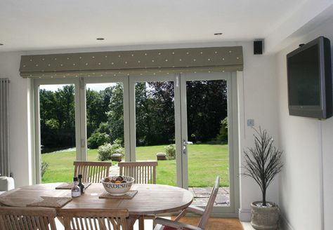 Kitchen with bifold doors with Classic Roman Blind in Moghul embroidered cotton Jinda Spot in Stone. Roman Blinds For Bifold Doors, Roman Blinds On Sliding Doors, Roman Blind Patio Doors, Roman Blinds On Patio Doors, Dressing Bifold Doors, Roman Blinds Patio Door, Roman Blinds Sliding Door, Blinds Bifold Doors, Bifold Doors With Blinds