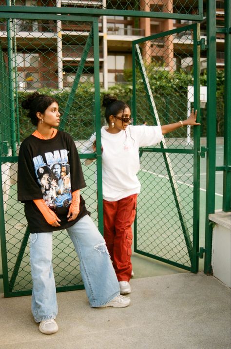 2 members of the Vixens Crew photographed in a candid way by a basketball court. Portrait, fashion photography. Basketball Court Photoshoot Fashion, 23mm Photography, Lifestyle Photoshoot Outdoor, Streetwear Fashion Shoot, Basketball Court Shoot, Candid Street Photography, Creative Clothing Photography, Photoshop Poses, Crew Photoshoot