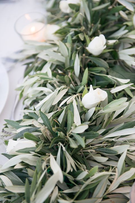 Olive leaves and white roses for the table decoration of your wedding  #realwedding #weddingplannergreece #weddingdeco Olive Branch Greenery, Olive Leaves Table Decor, Olive Tree Table Decoration, Olive Leaves Wedding Decor, Wedding Decoration Olive, Olive Branch Wedding Decor, Olive Leaf Decor, Olive Leaves Wedding, Olive Leaf Wedding