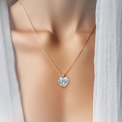 Presenting the epitome of romance and precision - our Captivating Heart Diamond Solitaire Pendant features a breathtaking 6.9-carat heart-shaped diamond that speaks the language of love through its exceptional quality and clarity. The diamond is masterfully cut to create an extraordinary sparkle, capturing every spectrum of light in a dance of brilliance. Available in the timeless elegance of 18K white gold or the sleek sophistication of platinum, this pendant is suspended on a complementary cha Language Of Love, Diamond Solitaire Pendant, Heart Diamond, Heart Shaped Diamond, Heart Pendant Diamond, Solitaire Pendant, Indian Jewellery, Diamond Heart, Diamond Solitaire