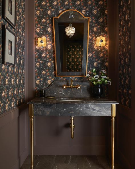 The Beverly Casa’s formal powder room: small space, big style. We think our powder room packs a punch! The focal point is definitely the incredible Arabescato Orobico custom marble slab vanity by Ann Sacks. The moody grays, browns and blacks inherent to this natural stone inspired the rest of the color palette - perfect for some powder room drama! The wood panels on the walls are painted in London Clay by Farrow & Ball. It’s a deep, saturated color aptly named for its earthy shade. We love ... Ann Sacks Bathroom, Formal Powder Room, Arabescato Orobico, London Clay, Moody Powder Room, Gucci Wallpaper, Sink Legs, Ann Sacks, Powder Room Design