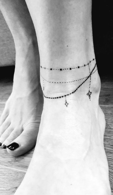 Permanent Anklet Tattoo, Womens Anklet Tattoos, Ankle Tattoo Bracelet Anklet, Ankle Charm Tattoo, Anklet Tattoo With Charms, Ankle Bracelet Tatoos, Thigh Bracelet Tattoo, Disney Anklet Tattoo, Bracelet Ankle Tattoo