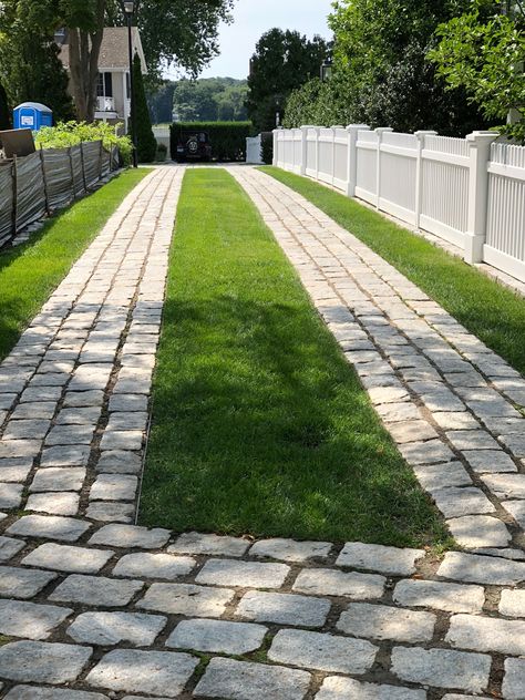 Beautiful and exceptionally done cobble stone and grass driveway in Essex, Connecticut. Stone And Grass Driveway, Brick Grass Driveway, Two Track Driveway, Concrete Grass Driveway, Concrete And Turf Driveway, Uphill Driveway Ideas, Modern Driveway Landscaping, Driveway With Grass In Between, Grass Driveway Ideas