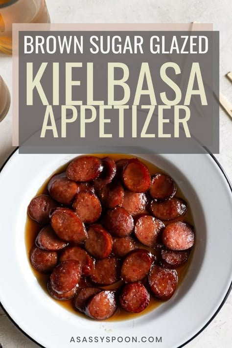 A white bowl with easy kielbasa bites in it with the words "brown sugar glazed kielbasa appetizer" in the foreground Crockpot Keilbasa Recipes, Kielbasa Bites Appetizers, Brown Sugar Kielbasa, Kielbasa Bites Recipe, Kielbasa Crockpot, Kielbasa Appetizer, Kielbasa Bites, How To Cook Kielbasa, Slow Cooker Kielbasa