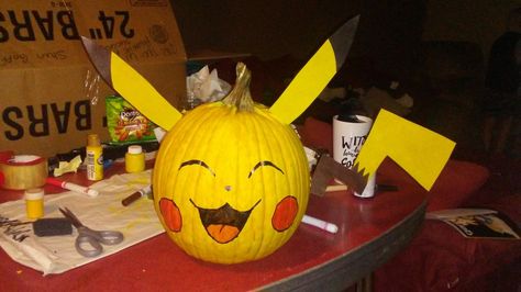 Pikachu Decorating Pumpkin Pikachu Pumpkin Painting, Pikachu Pumpkin, Halloween Pumpkin Crafts, Pumpkin Painting, Trunk Or Treat, Pumpkin Crafts, Fall Halloween Decor, Halloween Projects, Painted Pumpkins