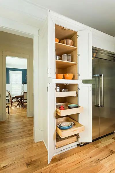 Tall pantry cabinet with upper shelves and bottom roll-out trays, shown in a Shaker style and White paint. Tall Kitchen Pantry Cabinet, Walk In Pantry Ideas, Simple Kitchen Cabinets, Kitchen Pantry Cupboard, Tall Pantry Cabinet, Open Pantry, Pantry Cupboard, Small Pantry, Large Pantry