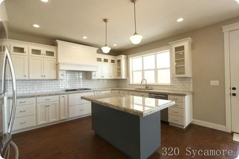 320 Sycamore's kitchen:  White dove cabs, revere pewter walls, giallo ornamental granite. Revere Pewter Walls, Revere Pewter Kitchen, Pewter Kitchen, Giallo Ornamental Granite, Pewter Paint, Glass Cabinets, Shaped Kitchen, Dove White, Home Building Tips