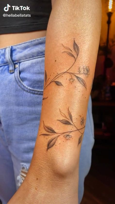 Floral Tattoo Around Wrist, Wrap Around Wrist Tattoos For Women Flower, Floral Elbow Wrap Tattoo, Small Elbow Tattoos For Women, Vine Arm Wrap Tattoo, Vine Tattoo Wrist, Vine Around Arm Tattoo, Elbow Flower Tattoos, German Tattoo Ideas For Women