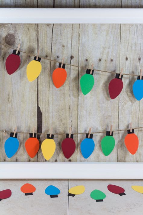 DIY Paper Christmas Lights Decoration | http://www.roseclearfield.com Christmas Paper Diy Decoration, Construction Paper Christmas Lights, Diy Christmas Decorations Classroom, Cricut Christmas Decorations Paper, Christmas Light Crafts For Kids, Christmas Wall Decorations Diy, Construction Paper Christmas Decorations, Diy Paper Christmas Garland, Easy Paper Christmas Decorations