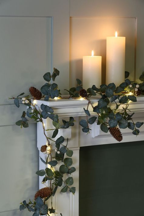 Eucalyptus is right on trend this Christmas, and its beautiful grey-green leaves have universal appeal. In this seasonal range, Laura Ashley have teamed faux eucalyptus leaves with frosted cones and faux snowberries, on a rustic willow ring, all wrapped with warm white micro LED lights on a clear string for a supremely subtle festive look. Ideal for both the modern and more traditional home, this natural-looking winter wreath will welcome your guests. For indoor use only. Battery powered, with … Large Garland, Ashley Green, Led Garland, Christmas Lights Garland, Winter Garland, Faux Eucalyptus, Eucalyptus Leaf, Green Eucalyptus, Small Wreaths