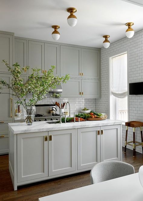 a classic dove grey kitchen with brass accents and vintage lighting plus white subway tiles Small Kitchen Decoration, Kitchen Ikea, Cabinet Paint, Kitchen Glass, White Kitchens, Small Kitchen Decor, Classic Kitchen, Grey Kitchen Cabinets, Classic Kitchens