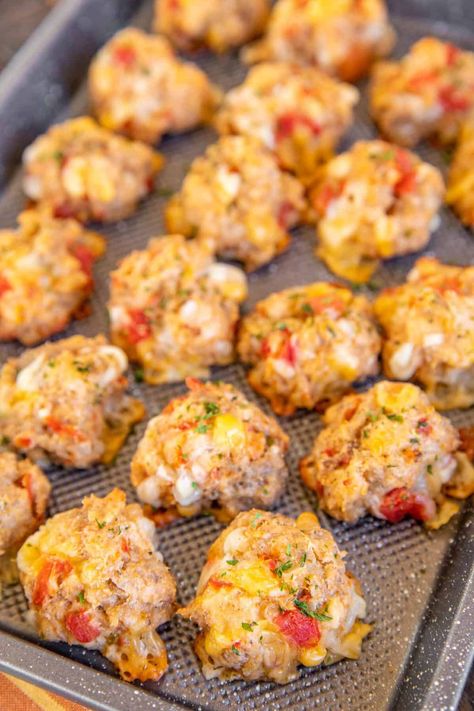 Rotel Cream Cheese Sausage Balls - a kicked-up version of our famous sausage balls! Only 5 ingredients - sausage, Bisquick, cream cheese, Rotel diced tomatoes and green chiles, and Mexican cheese blend. Can make in advance and freeze for a quick snack later. Great for breakfast, brunch, lunch, an appetizer at parties, and afternoon snacks. Whip up a batch ASAP! Total Cream Cheese Sausage Balls, Saturday Football Food, Rotes Cream Cheese Sausage Balls, Mexican Sausage Balls, What To Make With Pork Sausage, Sausage Balls With Rotel, Snacks For Wine Tasting, Bisquick Sausage Ball Recipe, Brunch Dips Appetizers