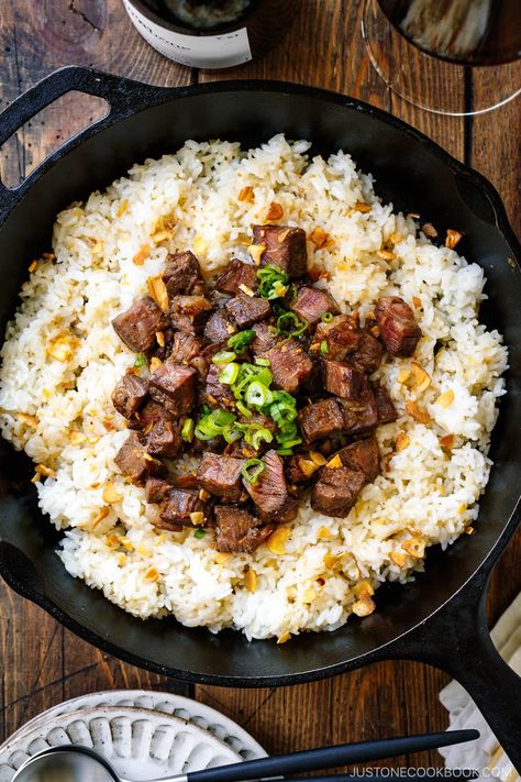 Dice-cut Wagyu steak over pan-fried crispy garlic butter rice seasoned with smoked soy sauce and topped with chopped scallions and garlic chips. #wagyu #steak #garlicrice | Easy Japanese Recipes at JustOneCookbook.com Filling Dinner Ideas, Dinner Ideas With Rice, Wagyu Beef Recipe, Chef Taro, Rice And Meat, Garlic Butter Rice, Rice Sides, Best Rice Cooker, Crockpot Steak