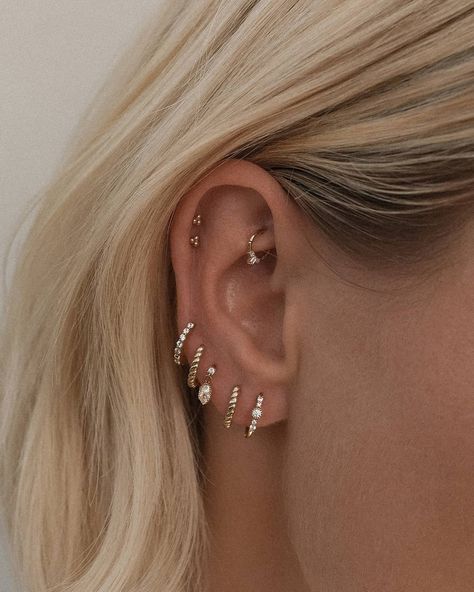 Solid gold treasures on the iconic ear of @karissasparke ✨ Karissa opts for out 14K Solid Gold hoops & piercings pieces that can take her through her daily surfs, yoga, taking care of a puppy & everything in between 🐶 Tap to shop her stack! ​ ​This week, we're playing... guess the collection name! We're launching something special oh so soon and I've been seeing all your guesses as to what it is... 😁 To be in the running to win a $100 voucher, guess what collection we'll be launching! Hint: Th Piercings Gold, Earlobe Piercings, Ear Piercings Chart, Piercing Chart, Double Ear Piercings, Diy Easter Gifts, Piercing Inspo, Face Piercings, Cool Gifts For Women